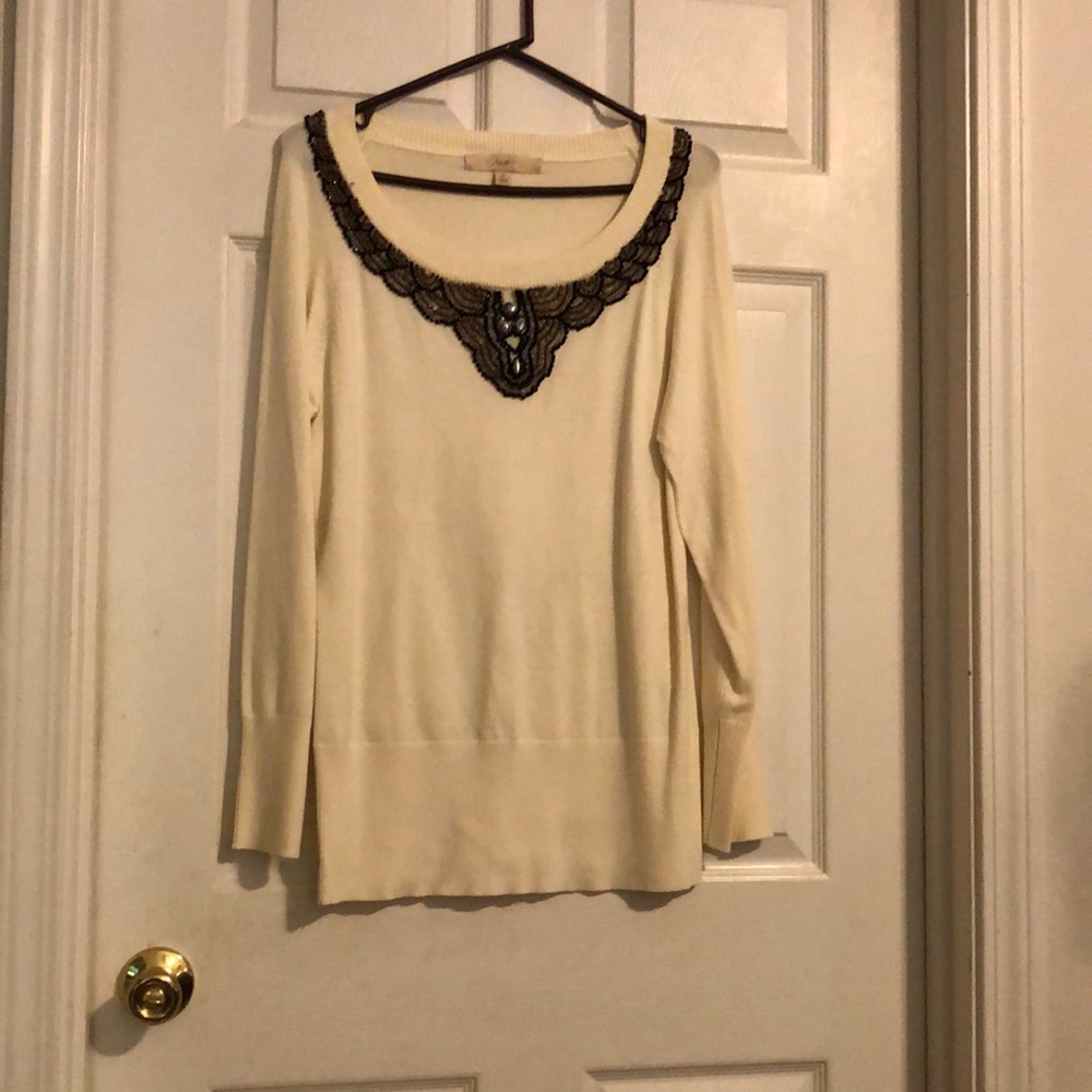 Embellished sweater.